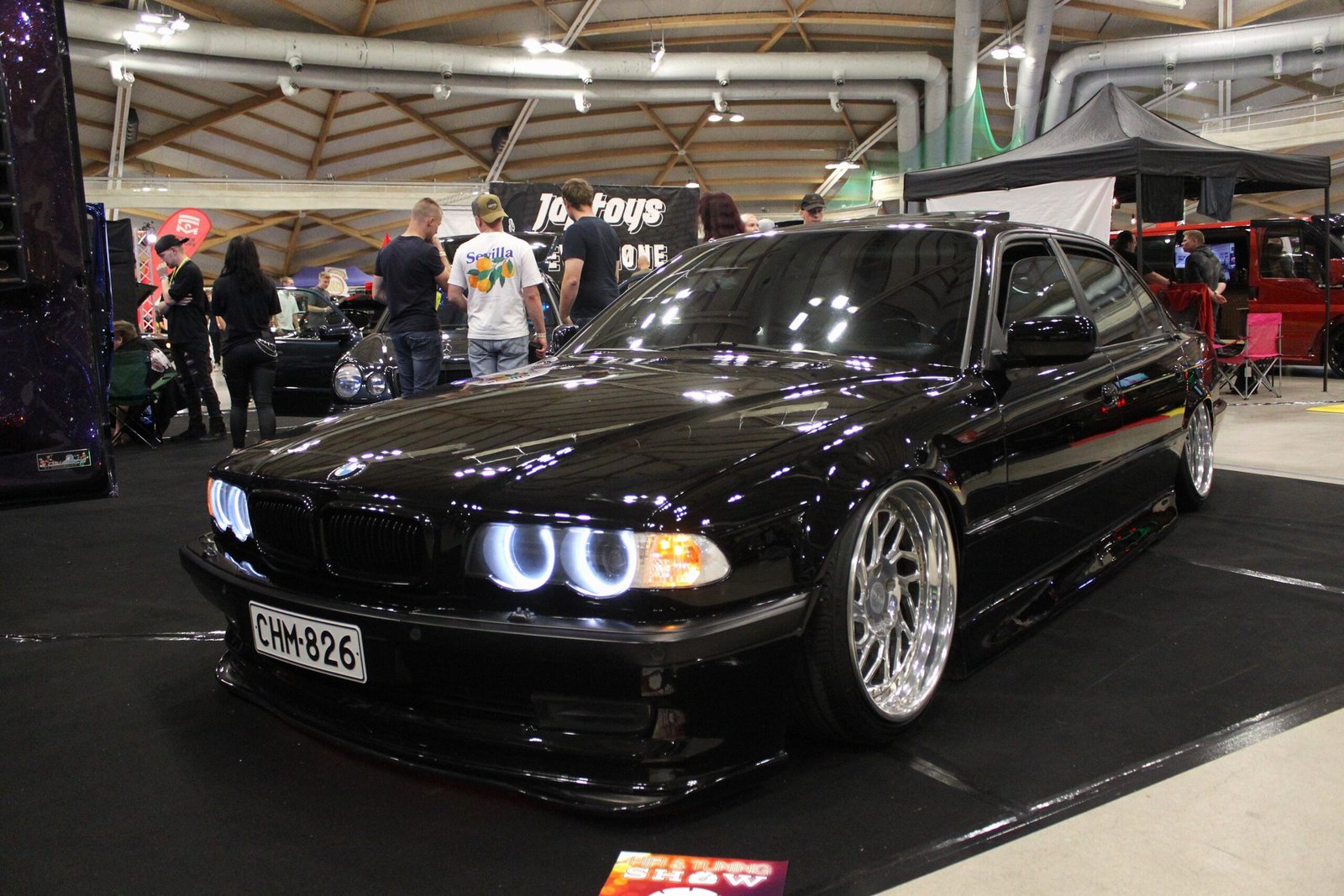 Black BMW 7 Series E38 with angel-eye headlights at a show &ndash; Wicked Street Customs