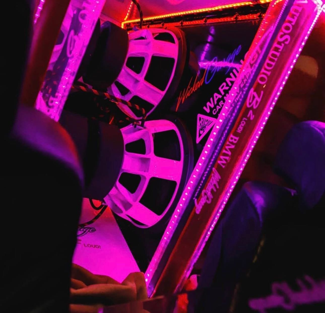 Custom car audio install with magenta-lit subwoofers &ndash; Wicked Street Customs