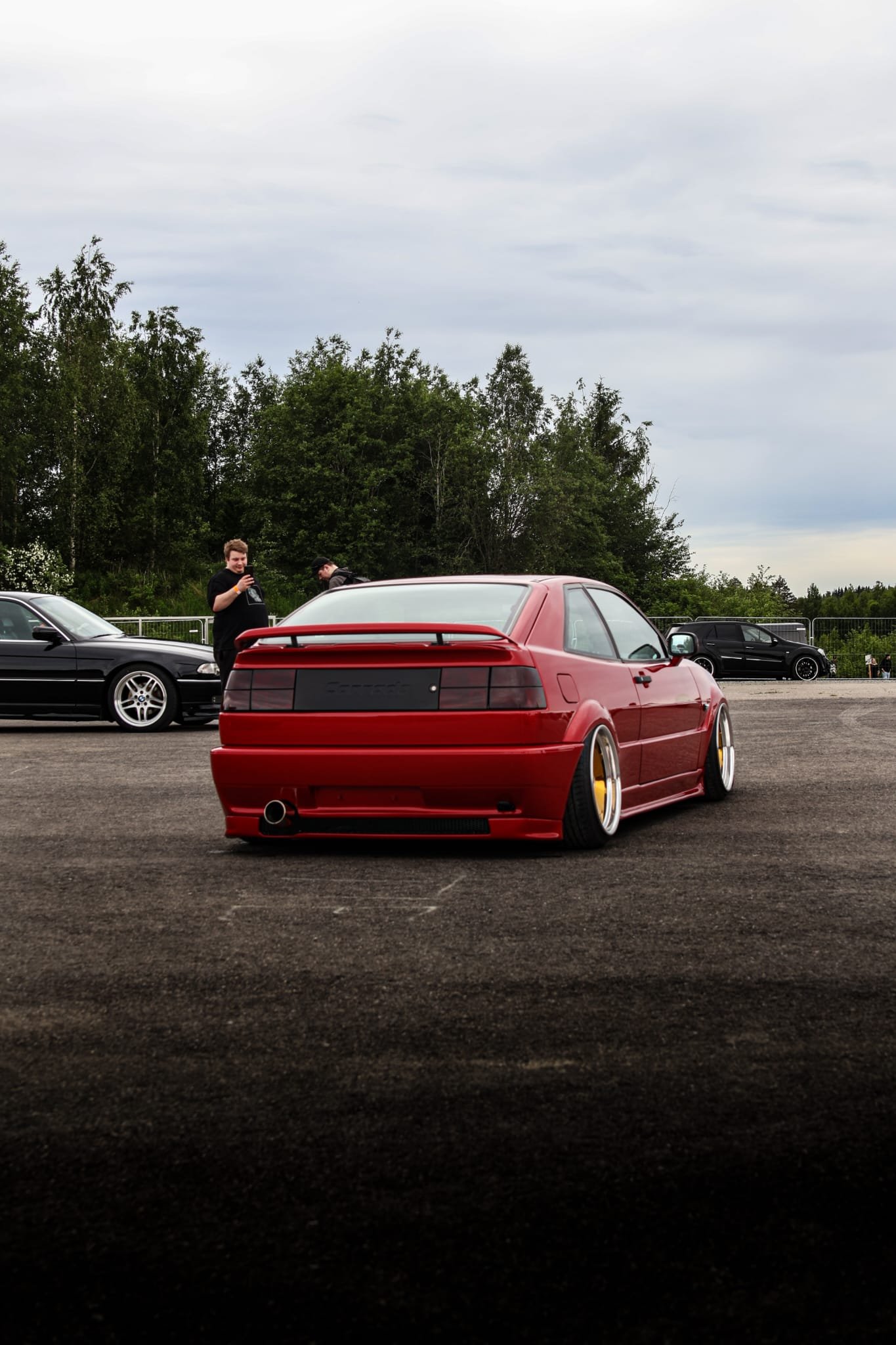 Lowered red Mercedes-Benz at a car show &ndash; Wicked Street Customs
