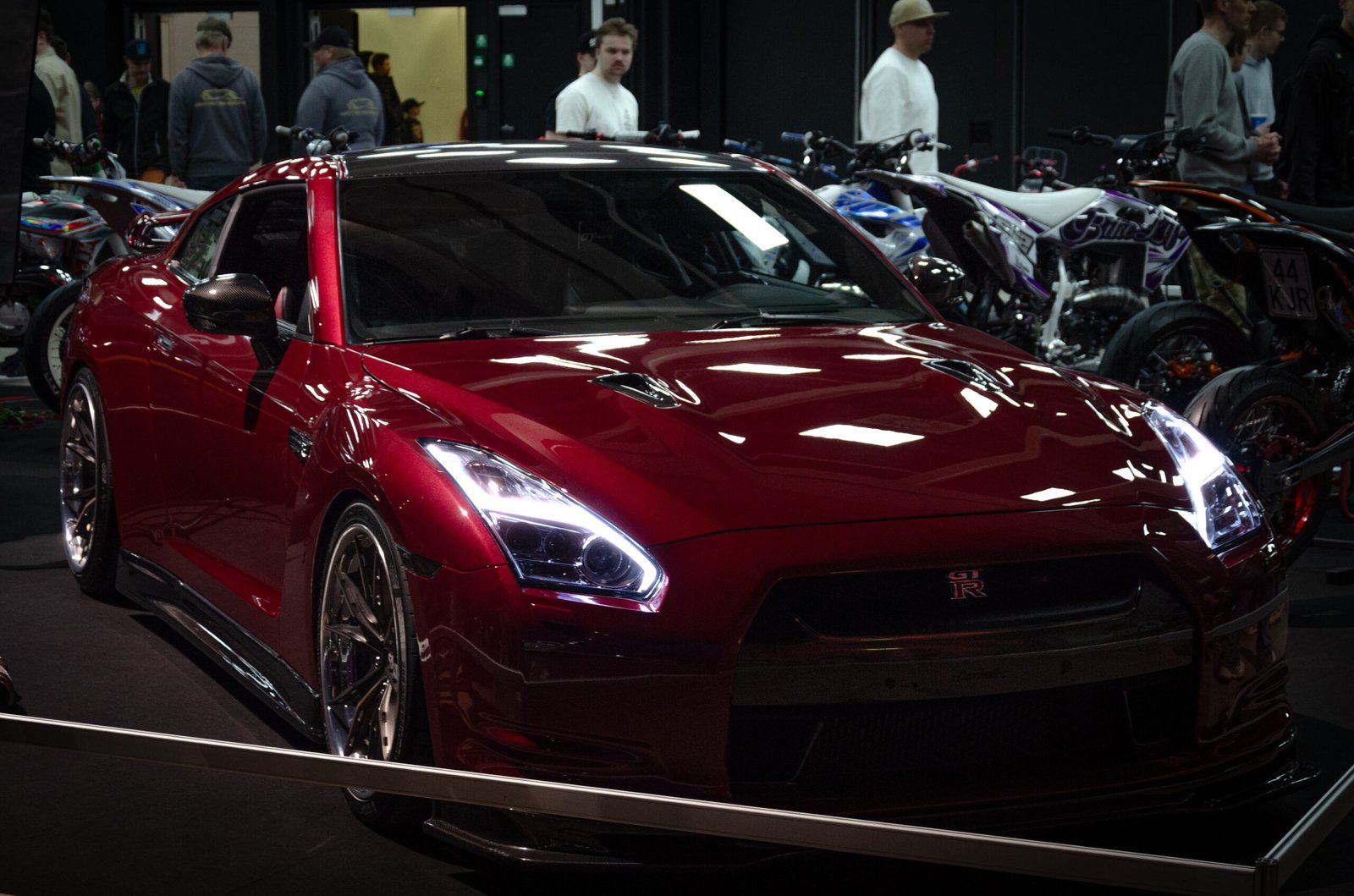 Dark red Nissan GT-R at a car show &ndash; Wicked Street Customs
