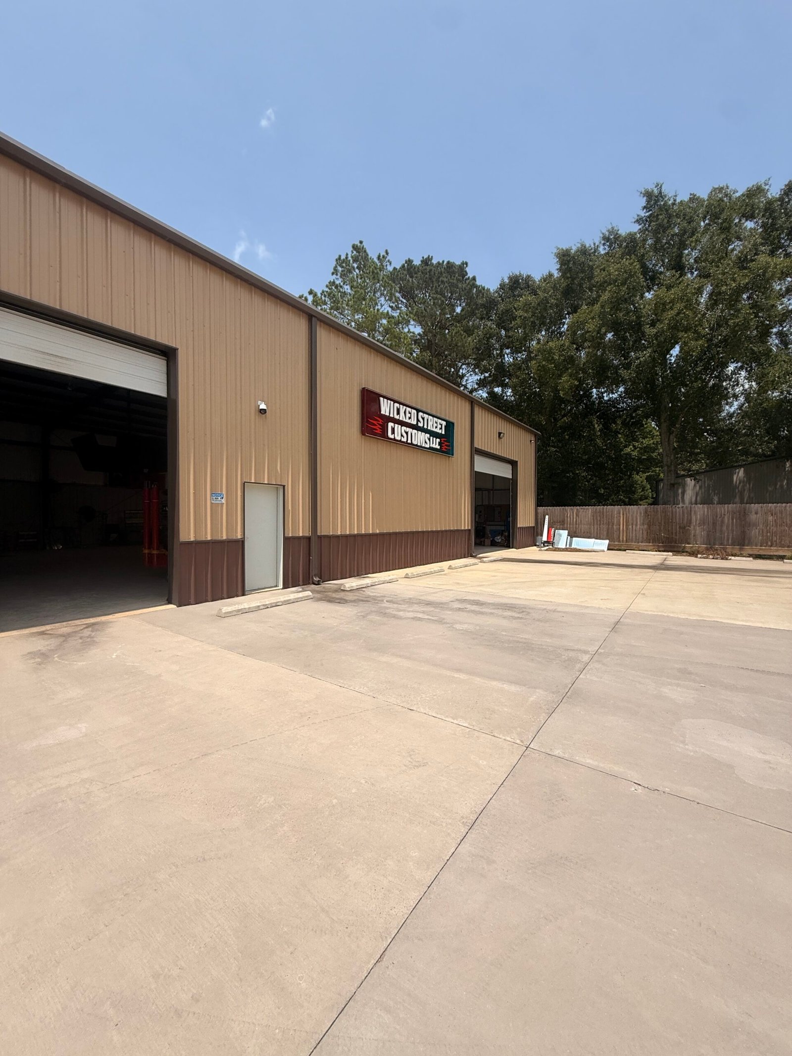 Exterior of the Wicked Street Customs shop building in Magnolia, TX &ndash; Wicked Street Customs